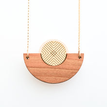 Detail image of caramel brown wood, metallic gold and bone white semicircle necklace with gold chain by Bird of Virtue