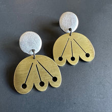 brass dangle flower earring from round silver posts on grey background