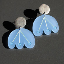 Pale blue flower earrings with blue dots dangle from circular silver post by Bird of Virtue