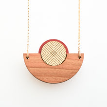 Detail image of caramel brown wood, metallic gold and rust semicircle necklace with gold chain by Bird of Virtue