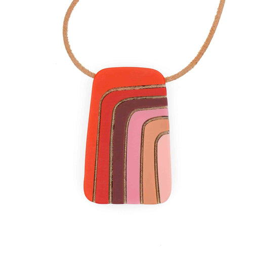 Necklace with a rectangular pendant featuring layered colors of red to pink on a white background