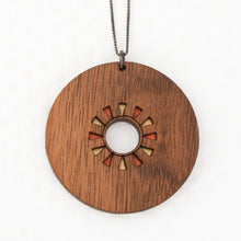 Circle wood Pendant with coral and metallic accents on white